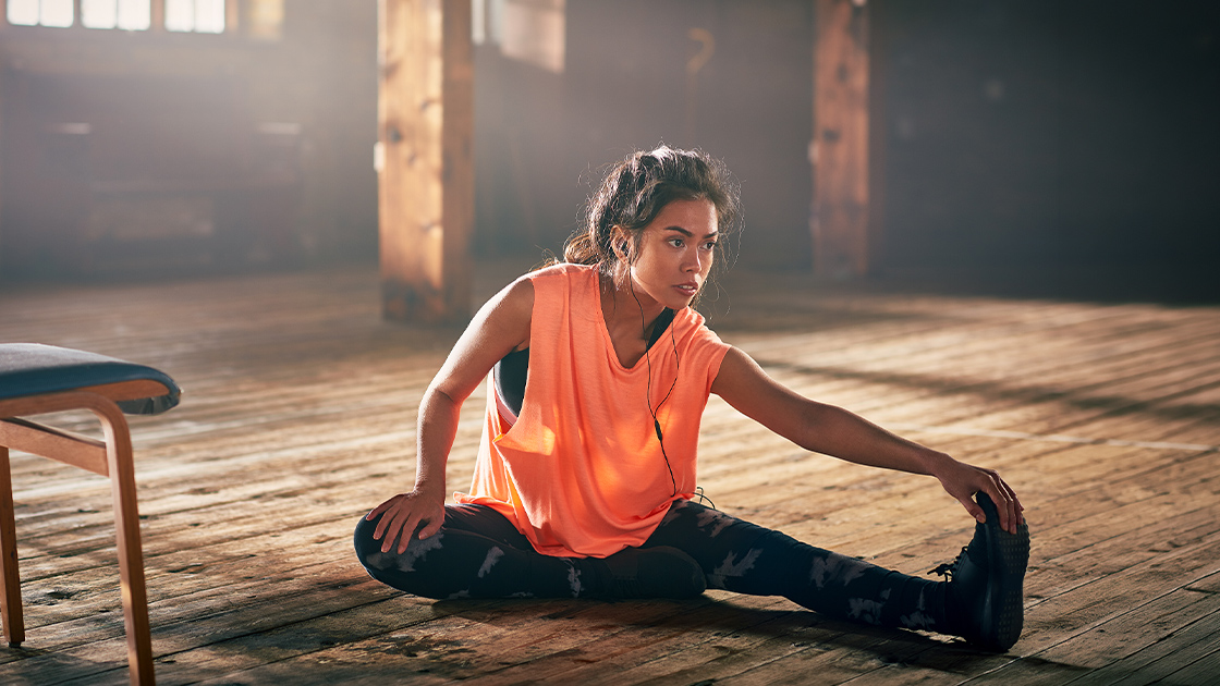 woman-stretching-wood-floor-16-9-1120x630px