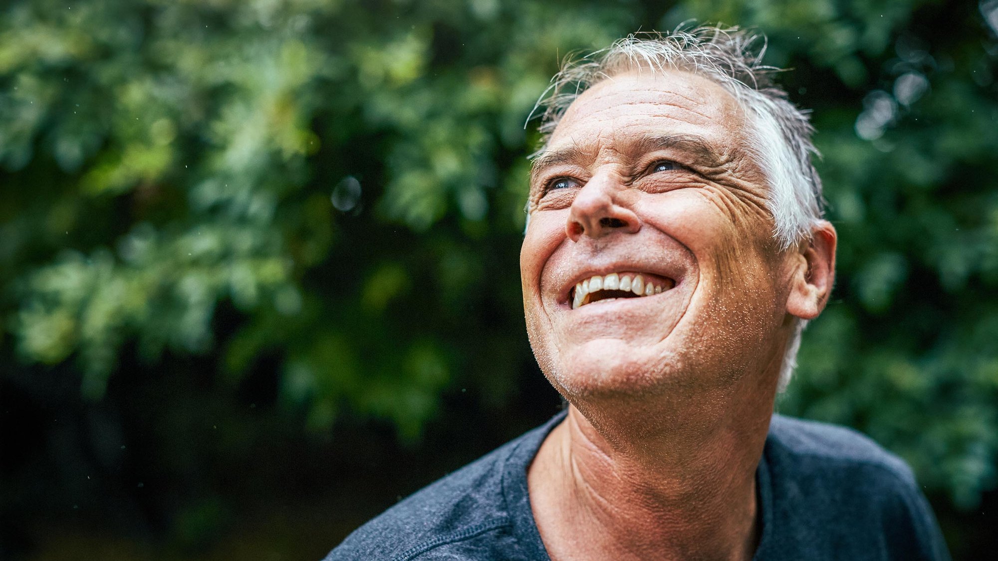 man-smiling-eyes-wellbeing-16-9-hero-2560x1440px