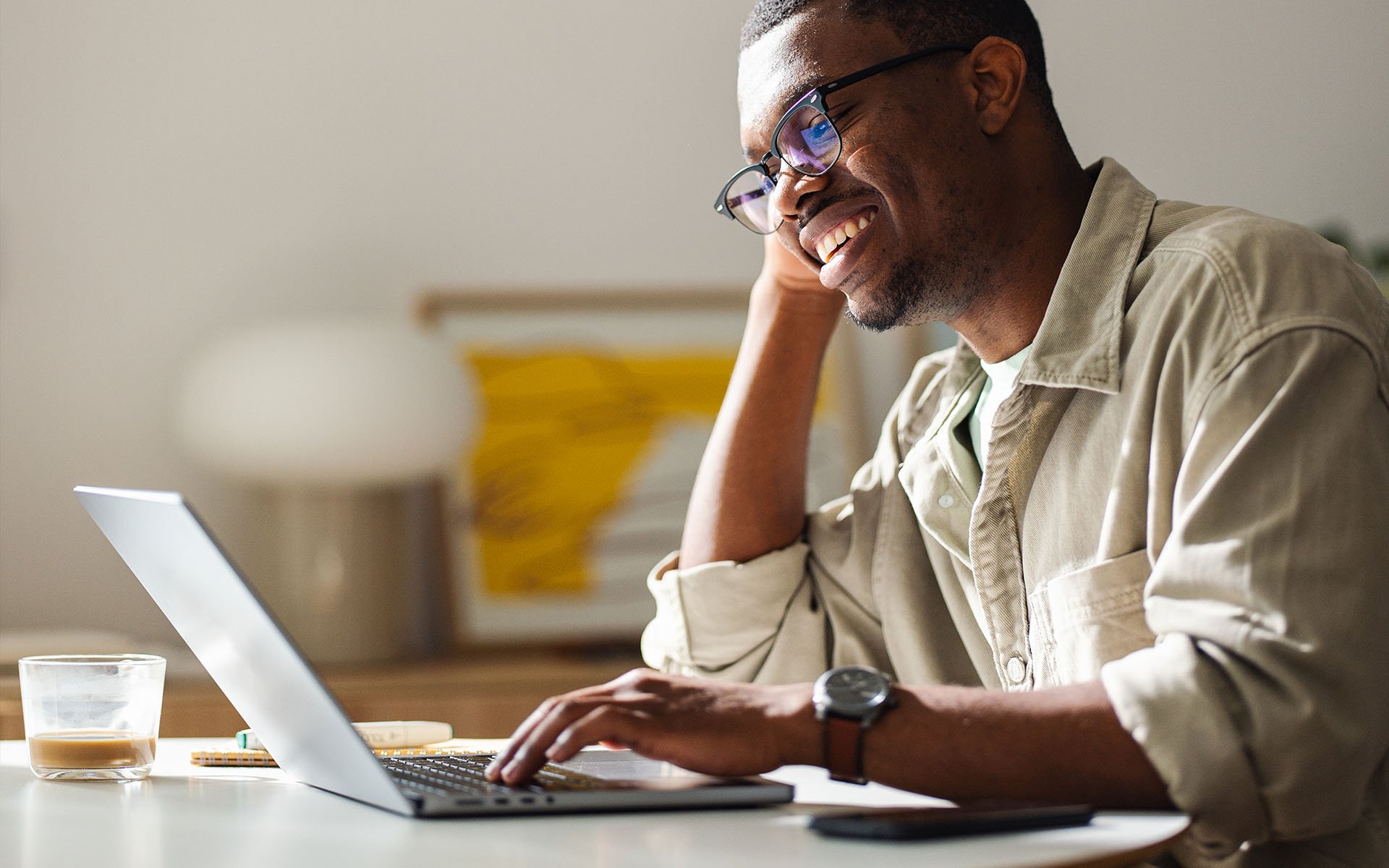 people-home-office-smiling-working-laptop-hero