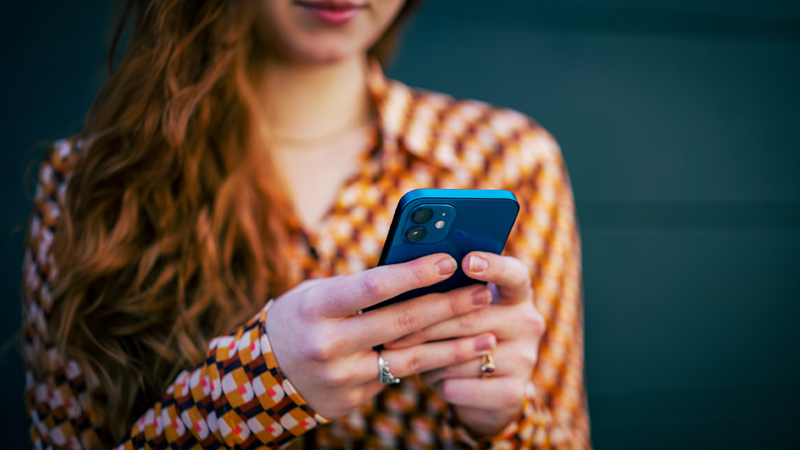 woman-using-phone-closeup-16-9-1120x630px