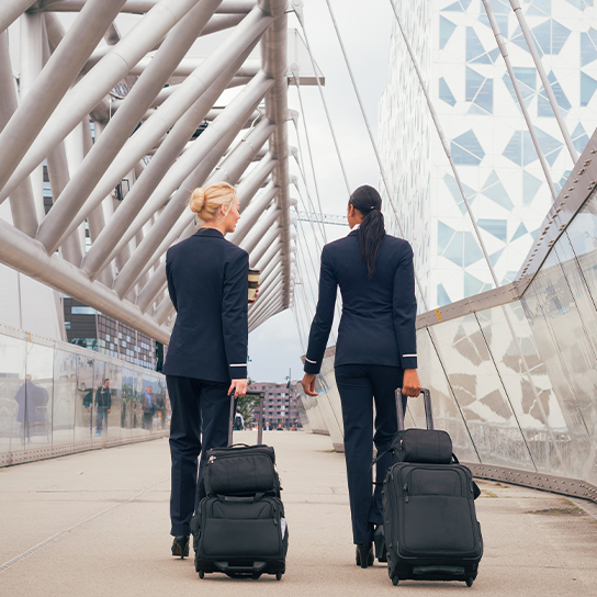 women-pilot-airport-travel-1-1-544x544px