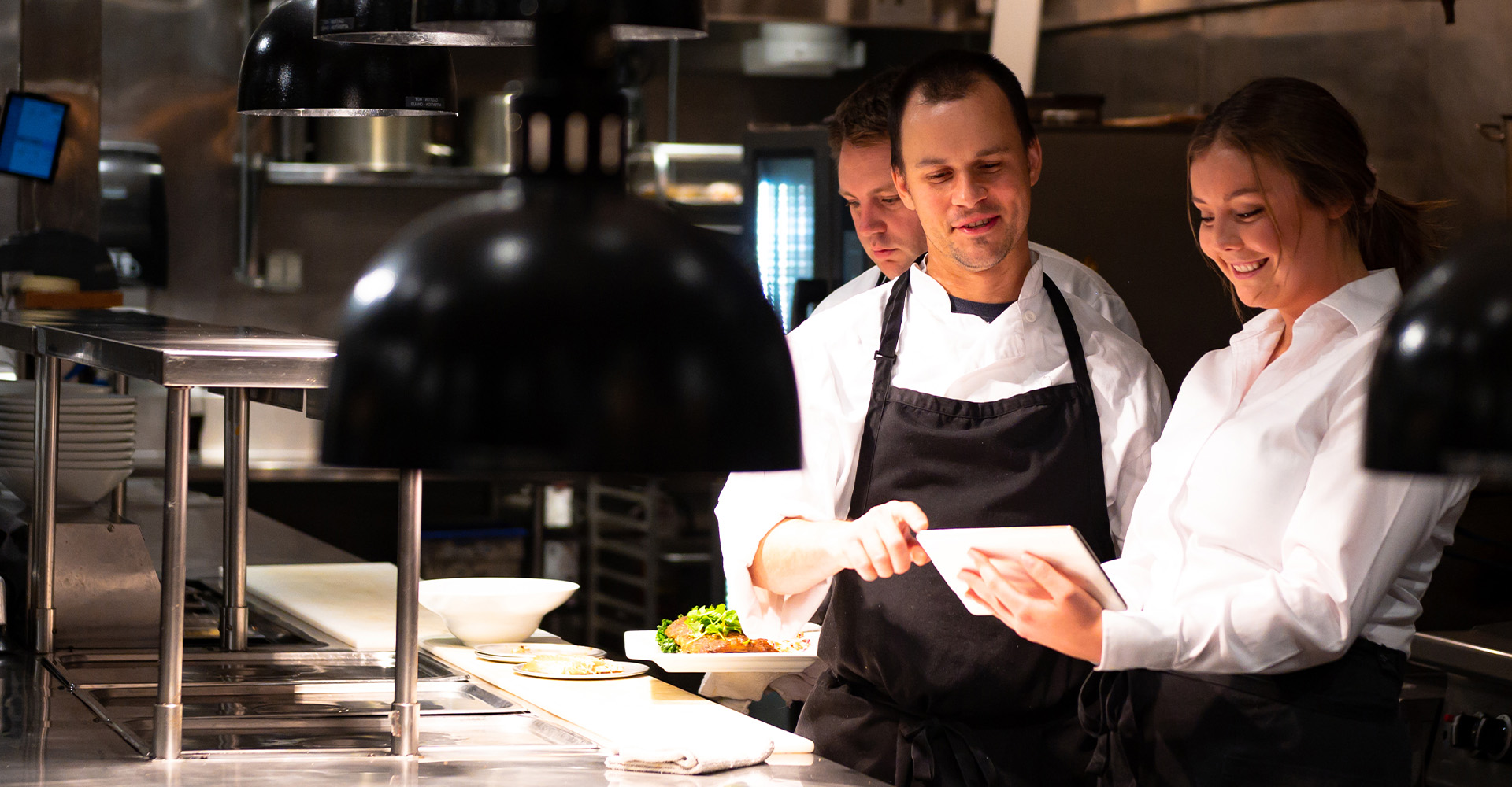 people-jobs-kitchen-staff-checking-order-hero