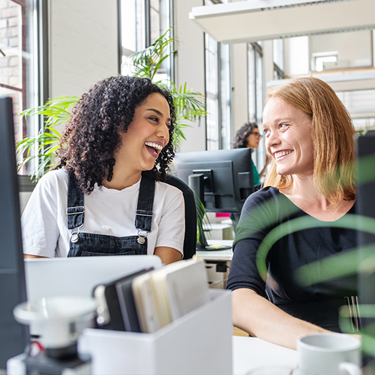 people-office-colleagues-smiling-desk-text-image-1-1